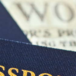 Image of passports and world newspaper